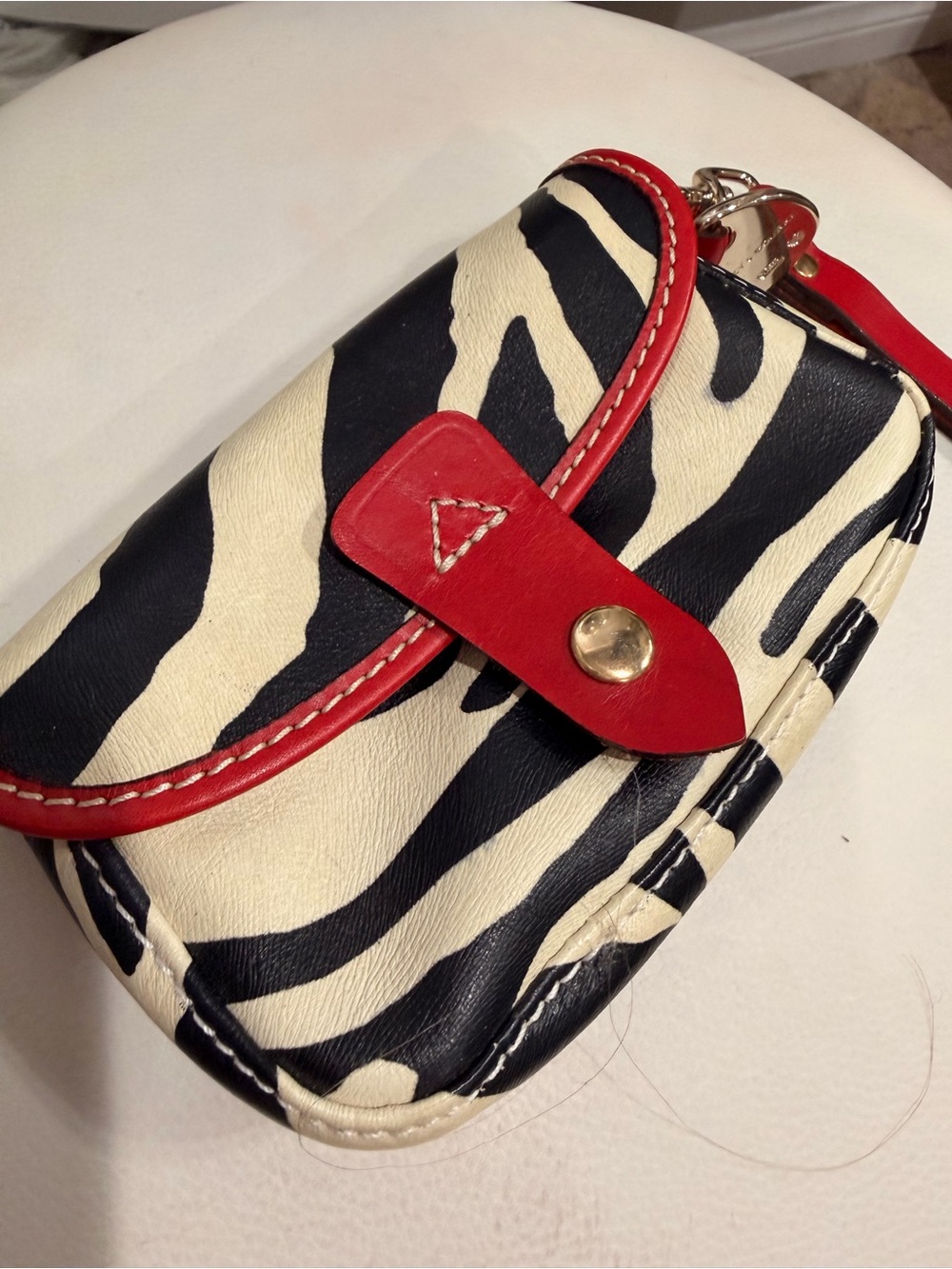 Dooney & Bourke Zebra Print Clutch with Red Trim